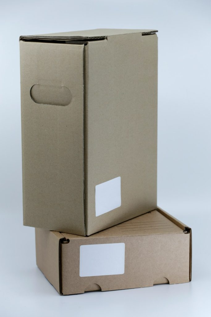 gray cardboard box on white table giz7jkt30rk.jpeg
